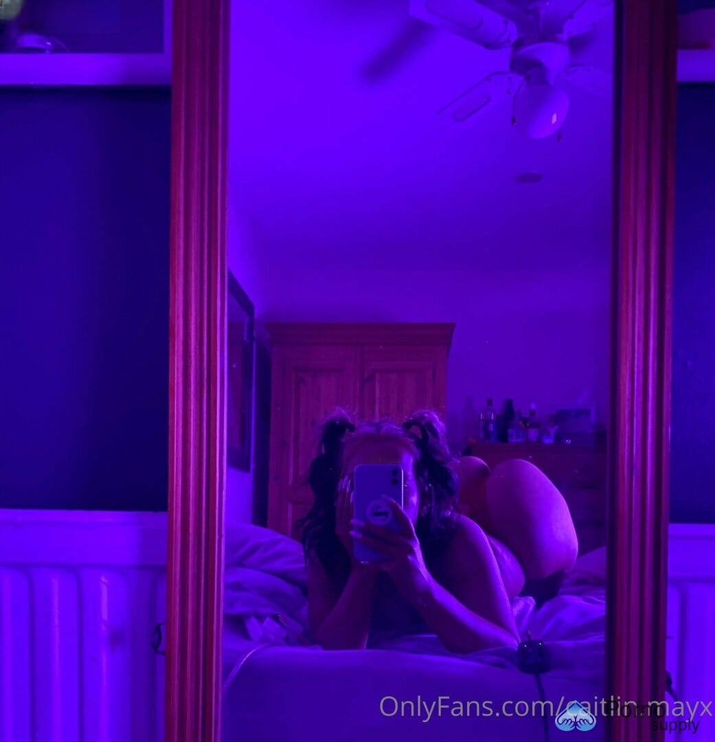 Caitlin May's gaze fixed in a seductive stare